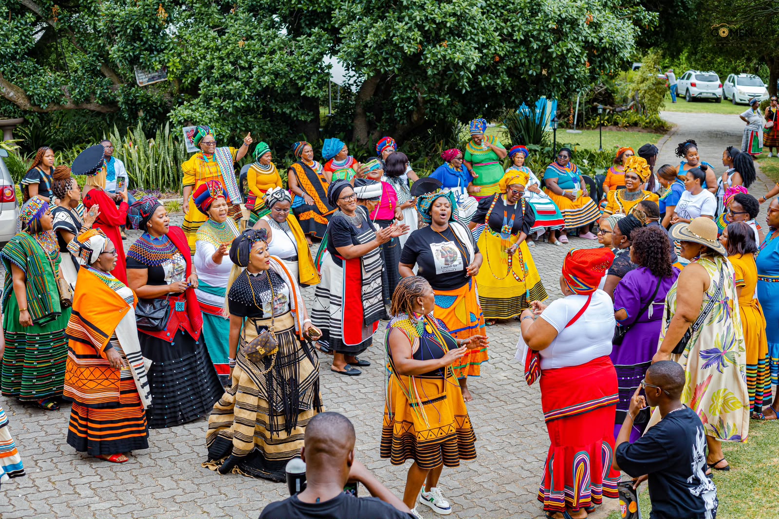 Crowd of women in Xhosa attire celebrating
