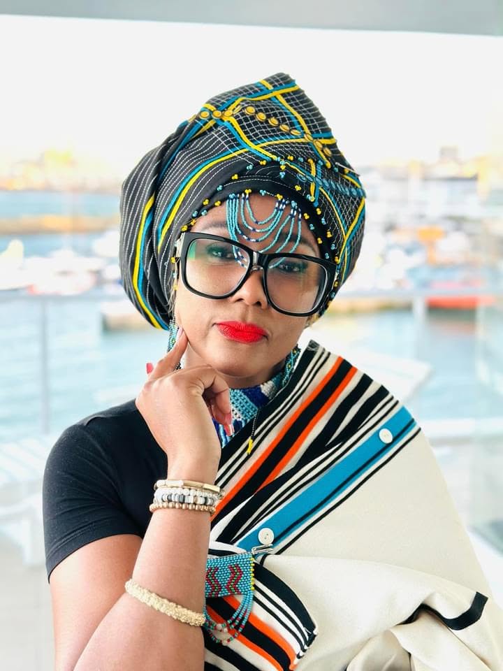 Bulelani Mooi, founder of UmfaziwomXhosa, wearing traditional Xhosa headwrap and beadwork.