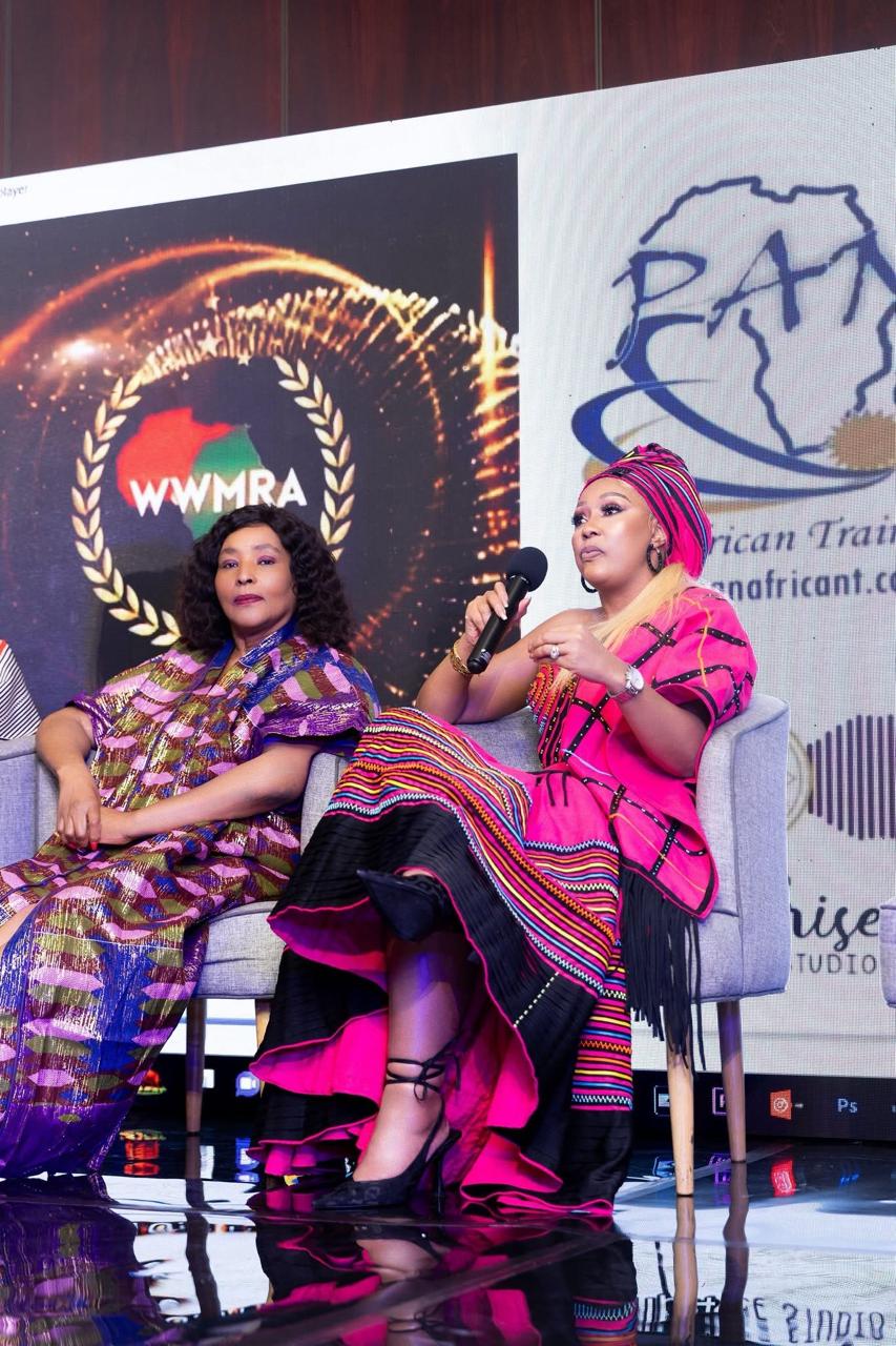 Buli on a panel in vibrant pink Xhosa attire